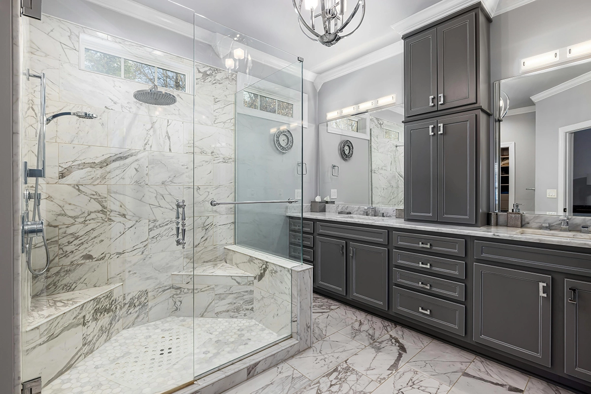 Elegant bathroom with glass shower and dark cabinetry – Home Upgrade Ideas for Campbellford by Renossance