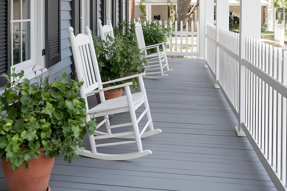 Classic front porch with white rockers – custom deck builds in Havelock by Renossance