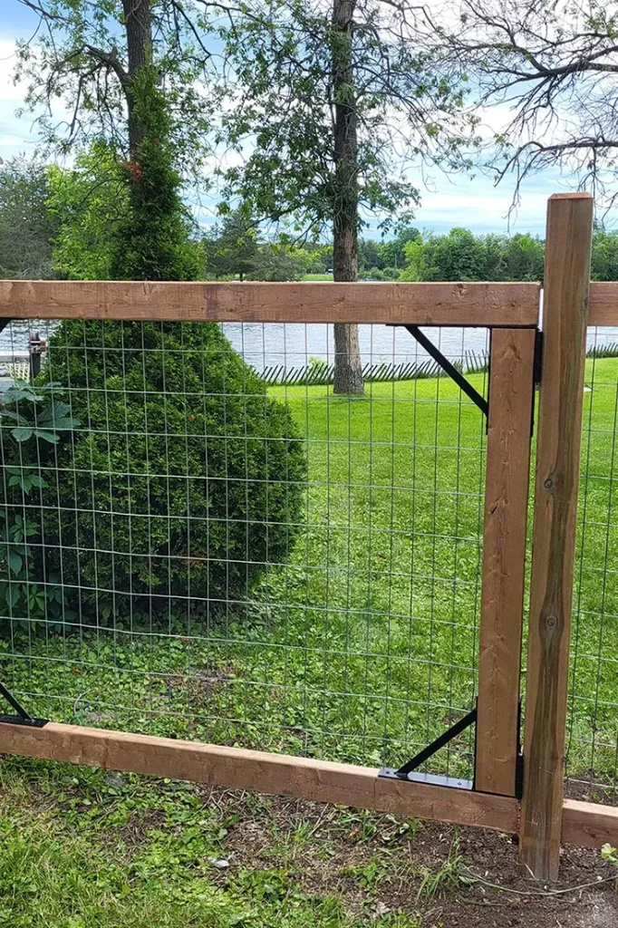 Wooden and wire fence near garden - Fence Installation and Fence Repair Campbellford by Renossance