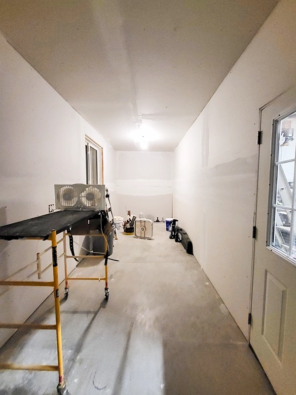 Drywall Repair and Drywall Installation Norwood – renovation space with drywall work in progress