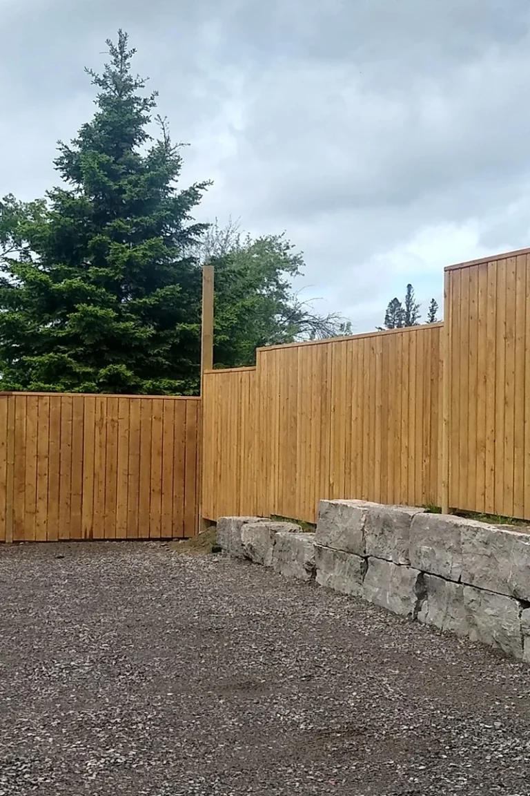 Tall wooden fence with stone base — Fence Installation and Fence Repair Warkworth by Renossance