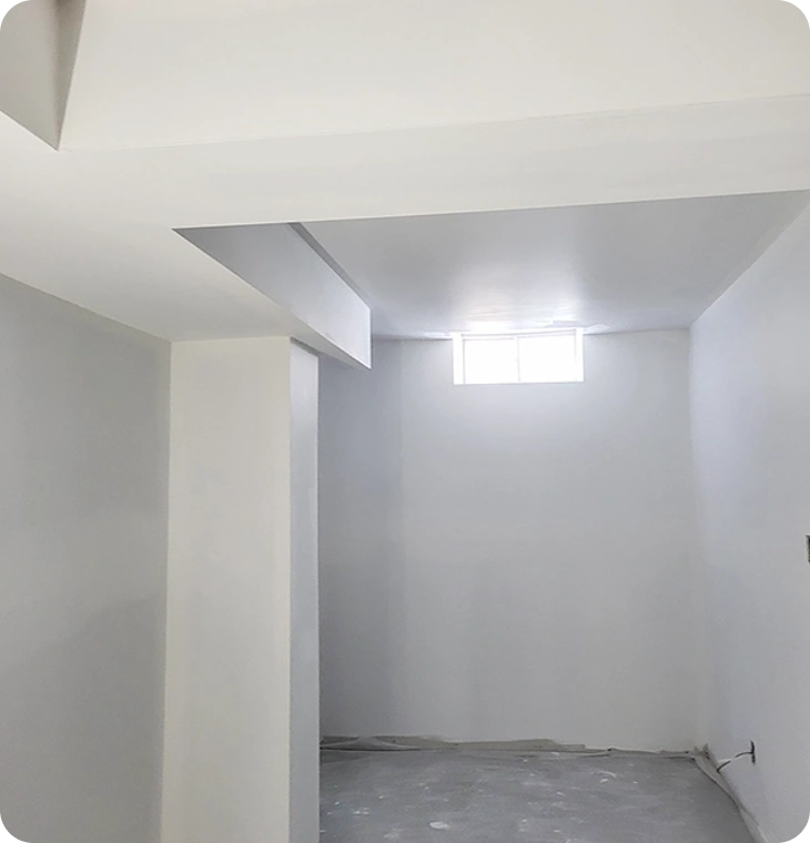 Bright finished walls and ceiling from basement renovations in Havelock by Renossance.