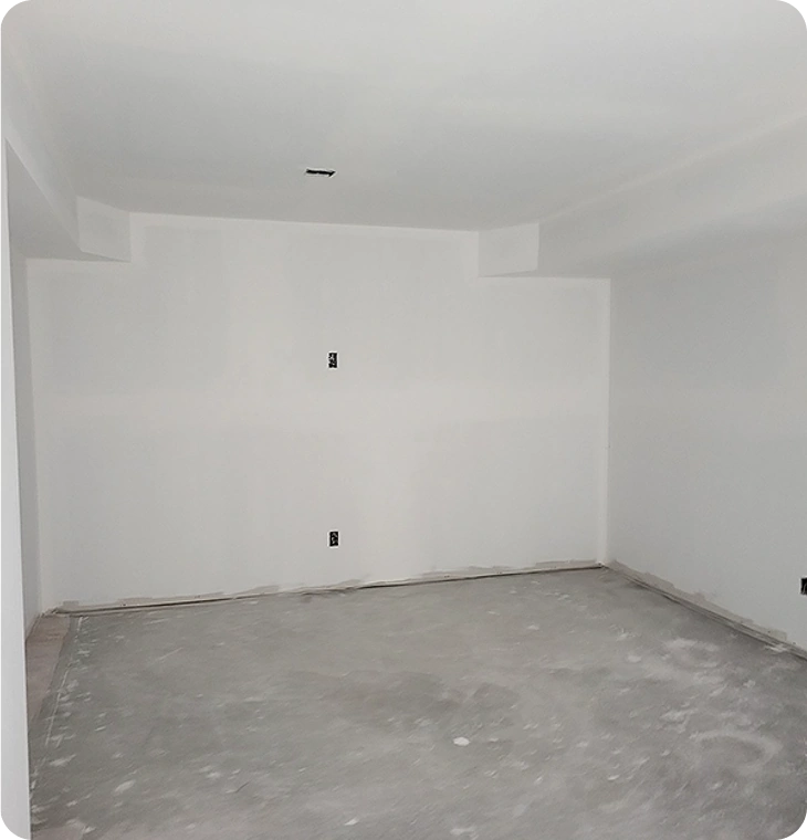 In-progress basement renovations Hastings by Renossance with drywall and floor prep underway.