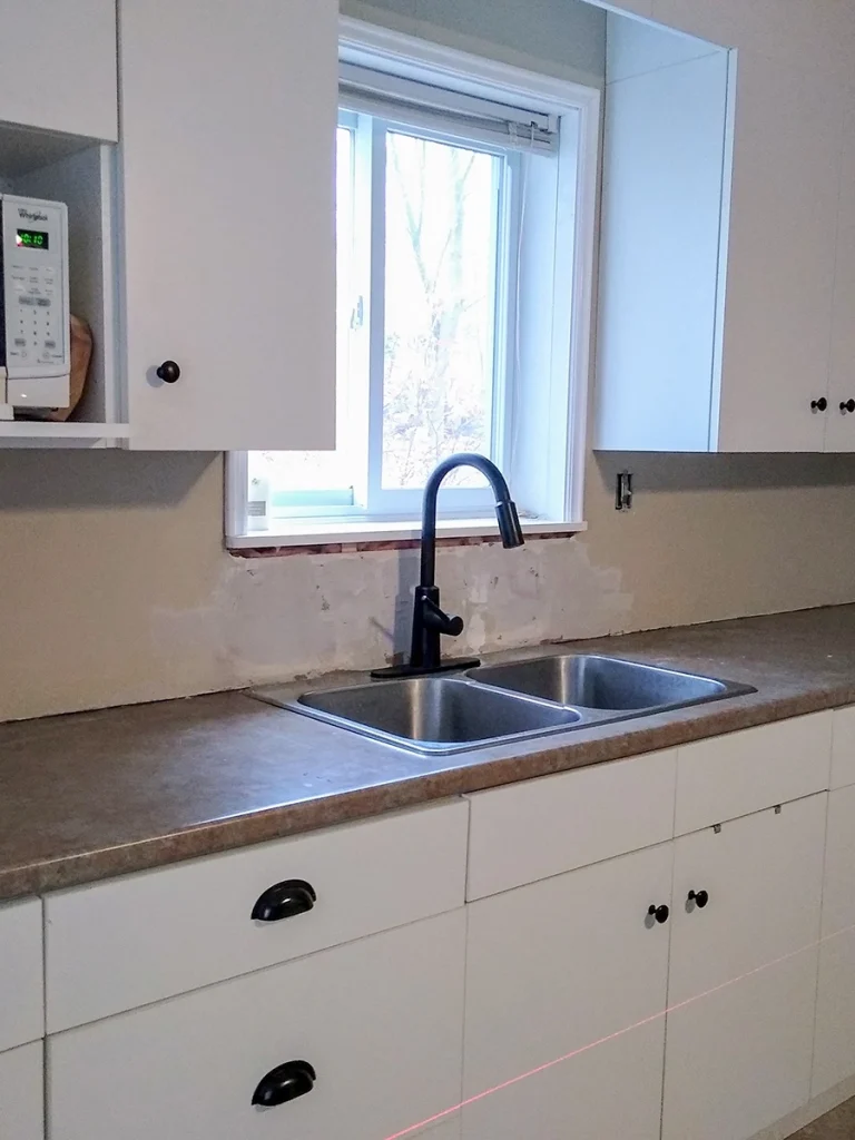 Kitchen sink and cabinetry update from a kitchen renovations Marmora by Renossance.