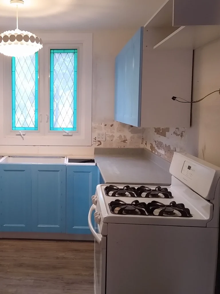 Blue cabinetry and prep work from a kitchen renovation in Norwood by Renossance.