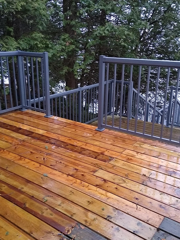 Wet multi-level deck with metal railings – Deck Repair and Deck Installation Stirling, ON