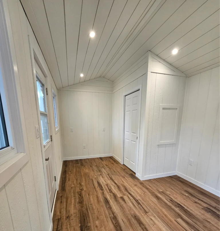 Painted white shiplap interior walls and ceiling in Campbellford cottage by Renossance