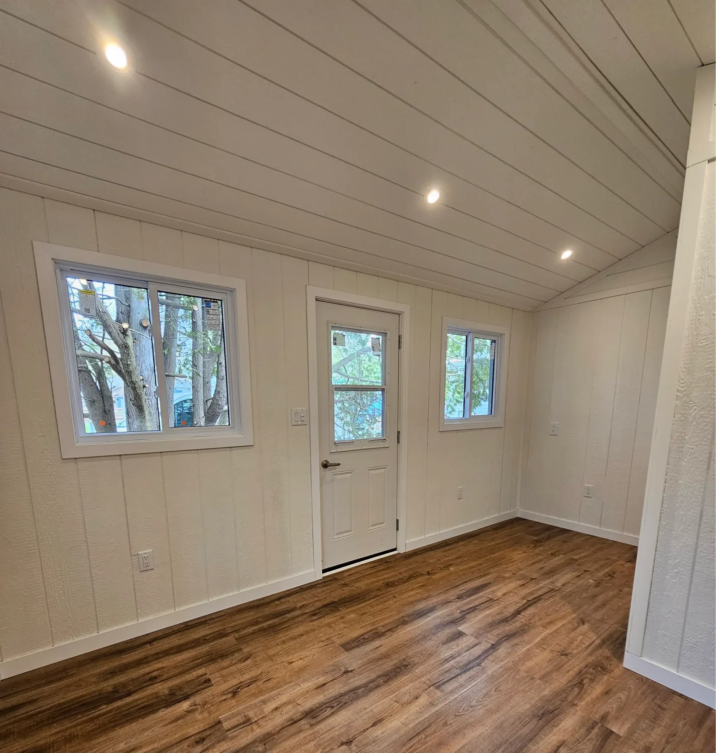 Painted white shiplap interior walls and ceiling in Hastings cottage by Renossance